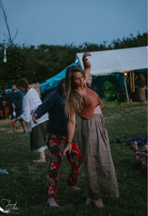 Emma Alwyn somatic sexologist, festival dancing candid shot