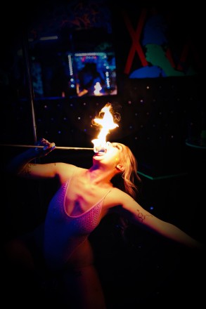 Cupids Swingers Club: Manchester's best sex parties and clubs. Fire breathing girl, brand image