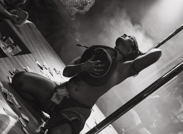 House of Scorpio, black and white brand image of pole performer dancing