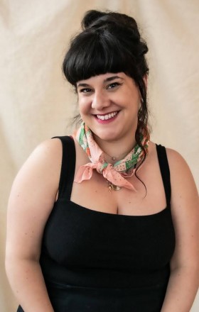 Women's intimacy and pleasure coach, Angie Enger: professional smiling portrait shot